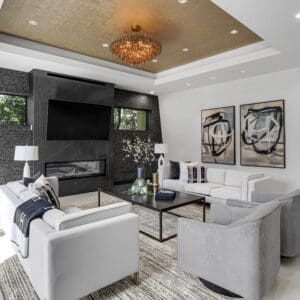 Modern living room with fireplace and artwork.