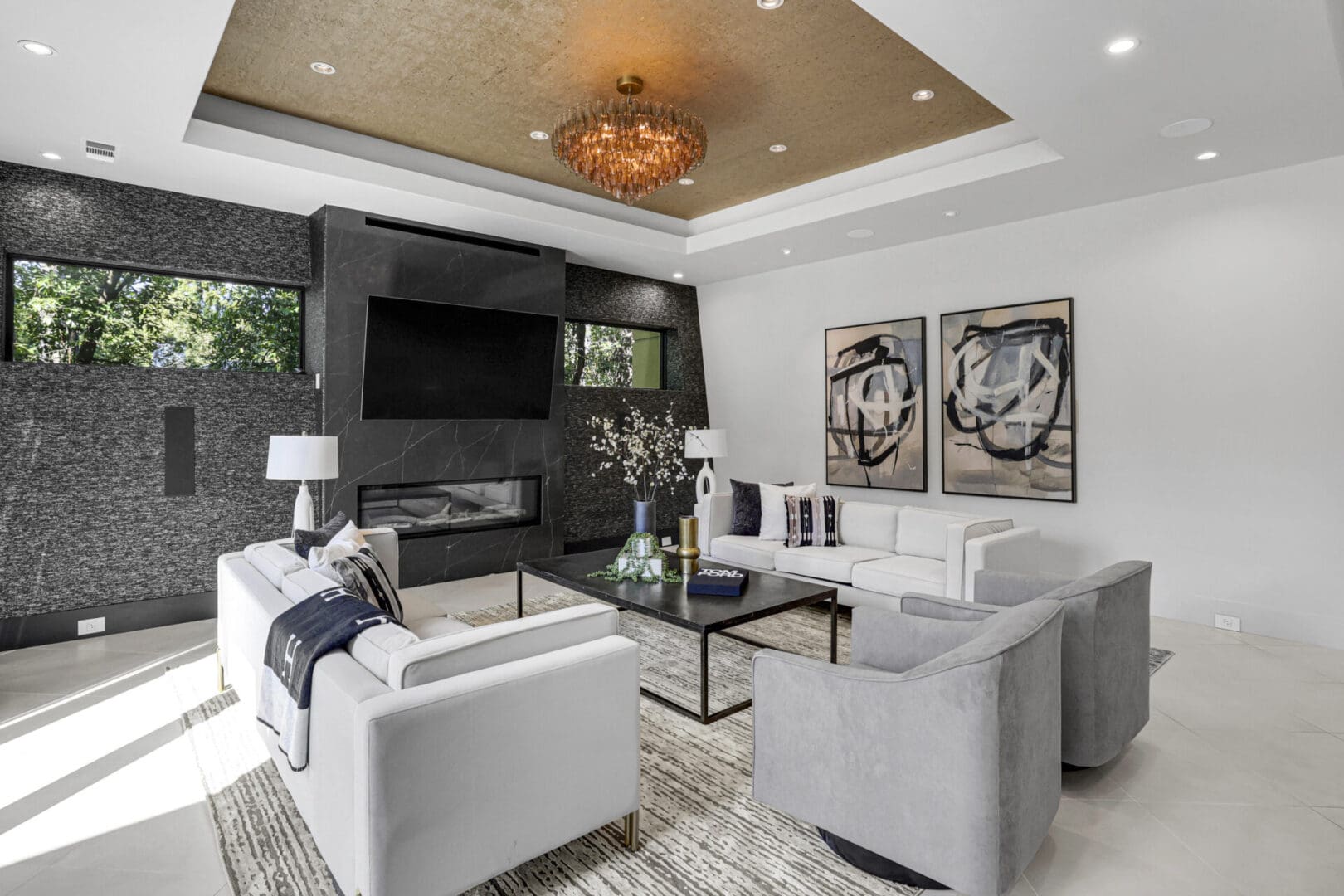 Modern living room with fireplace and artwork.